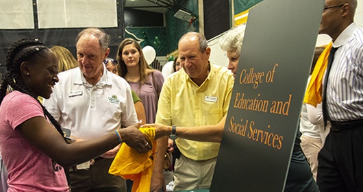 Student at College of Education and Social Services table